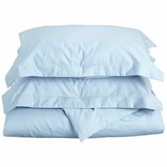 three pillows stacked on top of each other in front of a white background with blue sheets