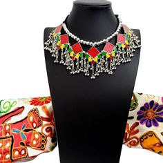 Summer is here! Celebrate with a colorful, playful, fun choker that compliments your wardrobe. Excellent quality, detailed ghungroo dangles, saturated vivid colors. Comfortable silky black cord tie, adjustable to the perfect fit for you. Shop chokers here: https://www.etsy.com/shop/boutiquebymaryam?section_id=23900841 Be sure to visit the rest of my shop here: https://www.etsy.com/shop/boutiquebymaryam Multicolor Beaded Necklaces With Latkans For Festivals, Traditional Necklaces For Festivals, Traditional Necklaces For Festival Gifts, Traditional Festival Necklaces As Gifts, Handmade Bohemian Choker For Celebration, Handmade Festival Necklaces, Festive Multicolor Beaded Necklace With Latkans, Bohemian Tilla Necklaces As Gift, Bollywood Choker Necklace For Festivals