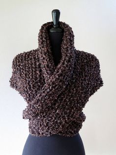 a knitted shawl on a mannequin