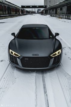 an audi sports car parked in the snow