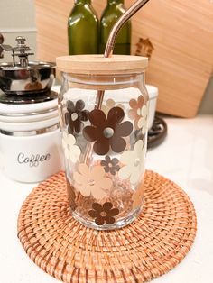 a glass jar sitting on top of a wooden coaster