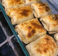 some food is sitting on a tray in the oven and ready to be cooked for consumption