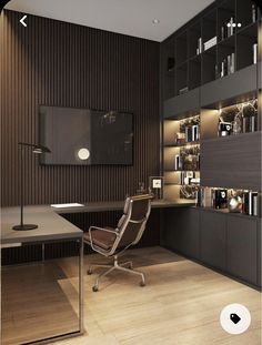 a room with a desk, chair and bookcases on the wall next to it