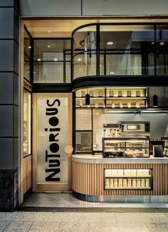 the interior of a sushi restaurant with an open door and window on one side