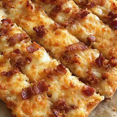 a pizza with cheese and bacon on it