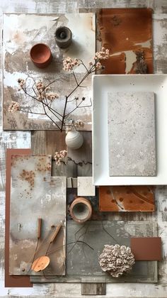 an arrangement of various objects on top of a wooden table with white and brown paint