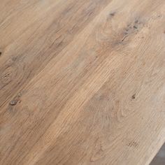 a close up view of a wooden table with no one on it or someone else