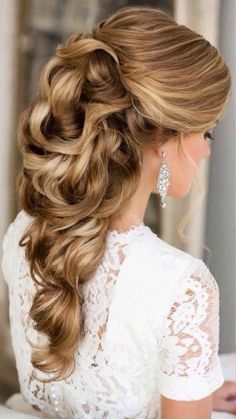 a woman with long hair in a half - up braid, wearing a white dress