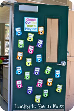 a door decorated with school supplies and the words check out years playlist written on it