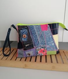 Step into the world of upcycled fashion with this one-of-a-kind denim clutch. Perfectly pieced together from a variety of denim patches, this clutch is not just a purse, it's a testament to sustainable fashion. Each patch tells a story, contributing to the rustic appeal of this unique accessory. It's the perfect denim gift for her, whether she's a fashion enthusiast or an eco-conscious shopper. Handcrafted with care, this denim clutch measures approximately 8x5 inches, making it the perfect size Casual Clutch With Zipper Pouch, Rectangular Denim Bag With Zipper Pouch, Patchwork Pouch, Jeans Handbag, Upcycled Handbag, Denim Wristlet, Denim Clutch, Bag Jeans, Jeans Bags