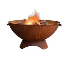 a fire pit sitting on top of a wooden stand with flames coming out of it