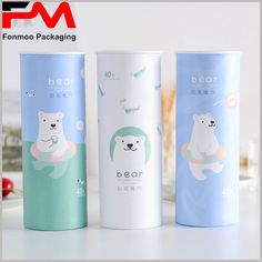 three different types of paper cups with polar bears on the front and bottom, one is blue