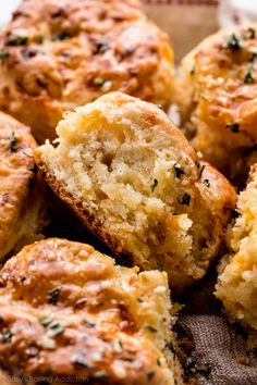 a close up of some muffins on a plate with one bite taken out