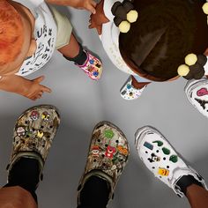 several people standing in front of a cake