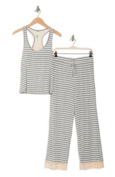 Lounge in ultimate comfort in this super soft scoop neck tank and pajama bottoms set. 2-piece set Top: 24" length; Pants: 13" rise, 29" inseam (size S) Top: scoop neck, sleeveless, racerback, knit construction, lace trim Bottoms: elasticized drawstring waist, pull-on style, knit construction, lace trim 95% rayon, 5% spandex Machine wash Imported Model’s stats for sizing: 5’11” height, 32” bust, 24” waist, 34” hips. Model is wearing size S. Casual Sleeveless Sleepwear, Casual Sleeveless Sleepwear For Loungewear, Comfortable Relaxed Fit Tank Top For Loungewear, Casual Stretch Sleepwear For Pajama Party, Casual Sleeveless Sleepwear For Lounging, Casual Relaxed Fit Tank Top For Loungewear, Pajama Bottoms, Honeydew, Grey Stripes