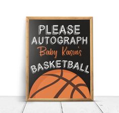 a chalkboard sign that says please autograph baby kassons basketball on it