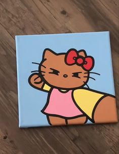 a painting of a hello kitty on a wooden floor