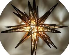 a star shaped light hanging from the ceiling