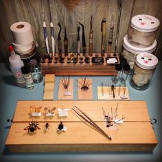 a collection of crafting supplies sitting on top of a table