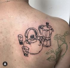 a man's back with a drawing of a kettle and cups on it