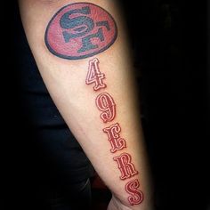 a man's arm with the number forty five on it and a football helmet