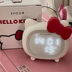 the hello kitty alarm clock is on display