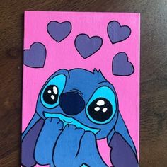 a painting of a blue cartoon character sitting on top of a pink background with hearts