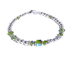 DARK Green Peridot (Olivine) August Birthstone Beaded Bracelets. Not Silver Plated - Not Silver Tone - Not Silver Finished Genuine Solid 925 Sterling Silver Accents on 57 Strand Woven Steel Cable. NO stretchy string or elastic. The sparkle of polished Sterling Silver, the dazzle of genuine Swarovski Crystals! You'll love this simple, classic Birthstone Bracelet - stack-able, well made, and trendy! Sterling Silver Birthstone Bracelet showcases Swarovski Crystals in sparkling simulated Birthstone Adjustable Green Bracelet For Birthday Gift, Green Adjustable Bracelet For Birthday Gift, Nickel-free Green Beaded Bracelets As A Gift, Nickel-free Green Beaded Bracelets For Gift, Nickel-free Green Beaded Bracelet For Gift, Green Nickel-free Beaded Bracelets As A Gift, Adjustable Green Beaded Bracelets As Birthday Gift, Adjustable Green Beaded Bracelet For Birthday Gift, Adjustable Green Beaded Bracelet For Birthday