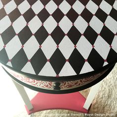 a black and white checkered table with red accents