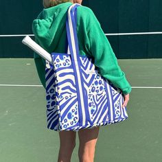 Make a fun statement on the court with this beautiful blue and white animal print tennis bag! Not only is this abstract animal print tennis tote bag nice to look at it but it is super functional too: perfect for carrying your racket, water bottle, and other daily essentials. It features a waterproof lining protective padded racquet compartment and lobster claw closure. Each piece is screen printed onto natural cotton canvas giving it a beautiful vibrant color. 100% natural cotton canvas, coated, Tennis Bag Aesthetic, Duck Umbrella, Tennis Tote, Abstract Animal Print, Tennis Bag, Senior Activities, Tennis Racquets, Man And Dog, Webbing Strap