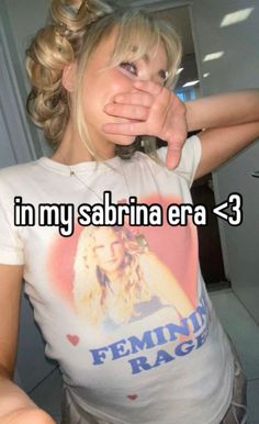 a woman with her hand on her face and the words in my sabrina era = 3