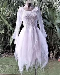 Make your occasion extra-special with one of our magical dresses.  *This beautiful fairy dress is made from high quality polyester body with three layers of soft tulle. *The dress has a stretch bodice to fit all sizes from 1XL up to 4XL. *Available in a large range of colours to choose from to suit your theme - from delicate pastels to deeper rich shades. *To add extra sparkle to the dress, it has scattered sequins sewn over the dress and beads at the hems.   A MATCHING GARLAND CAN BE PURCHASED Fairytale Fairy Dress With Ruffles For Costume Party, Fairytale Ruffle Fairy Dress For Costume Party, Fairytale Ruffles Fairy Dress For Fancy Dress, Fairy Style Dress-up Tulle Dress, White Fairycore Costume Dress, Spring Fairy Dress For Costume Party, Fitted White Fairytale Fairy Dress, Fitted Fairy Style Princess Dress For Wedding, Whimsical Tulle Fairy Dress With Ruffles