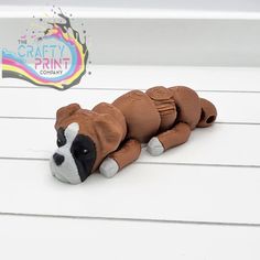 a brown and white dog toy laying on the ground