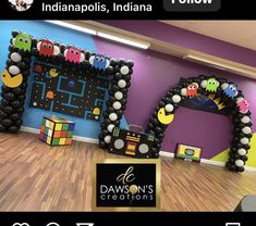 an image of a room decorated for halloween with balloons and decorations on the walls,