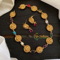 The Premium gold look alike an Navarathna Coin Choker Short Necklace enriched with Indian Heritage. Made with AD Stones and Antique embellishment perfect for any occasion, this necklace set will add charm to your appearance.  Color, shades, texture displayed may slightly vary from the actual product due to photography limitations. We humbly request you to consider these variations. We try our best to deliver the product pictures to 99% similar to the actual product. If you have any questions, please feel free to contact us. Jewellery Care: Keep the jewelry away from direct heat, water, perfumes, deodorants and other strong chemicals as they may react with the metal or plating. Wipe your jewellery with a soft cloth after every use. Always store your jewellery in jewellery box to avoid accid Cheap Traditional Necklace For Celebration, Coin Choker, Small Necklace, Indian Heritage, Beaded Bracelets Diy, Coin Jewelry, Wedding Jewellery Necklace, Jewelry Choker, Coin Necklace