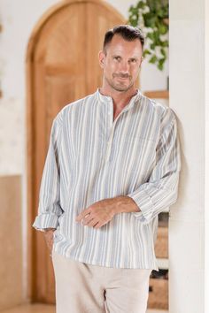 Designed with steel blue stripes, Jamriang's pullover shirt is a subtle way to stand out. Handcrafted from 100% cotton, the collarless shirt features a subdued stripe pattern, four buttons at the collar, and a single chest pocket.