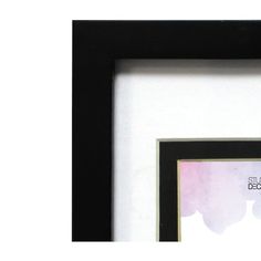 a black frame with a pink and purple watercolor painting on it that says still be beautiful