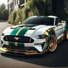 a white and green mustang with gold rims