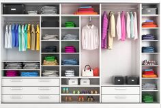 an organized closet with white drawers and shelves filled with shirts, t - shirts and other items