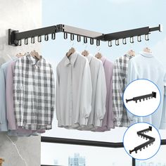 clothes hanging on rail in front of window with cityscape and ladder behind them