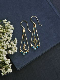 "This listing is for moon and star mismatched earrings in raw brass. These celestial earrings are a perfect witchy pair as they are super light weight. Made with three different shades and sizes of faceted apatite beads. Wire wrapped with utter most care out of raw brass, hammered for fun eye catching texture, polished to high shine. Perfect for casual everyday wear for anyone wanting a little bit of magic.  -⋄-⋄-⋄-⋄-⋄-⋄-⋄-⋄-⋄-⋄-⋄-⋄-⋄-⋄- ✧ ☾ MADE TO ORDER ☽ ✧ Production time is 1-5 Business Days Celestial Dangle Earrings For Everyday, Celestial Style Dangle Earrings For Everyday, Everyday Celestial Dangle Earrings, Celestial Drop Earrings For Everyday, 14k Gold Filled Moon Charm Dangle Earrings, 14k Gold Filled Dangle Earrings With Moon Charm, Celestial Style Earrings With Ear Wire For Everyday, Celestial Style Everyday Earrings With Ear Wire, Everyday Celestial Style Earrings With Ear Wire