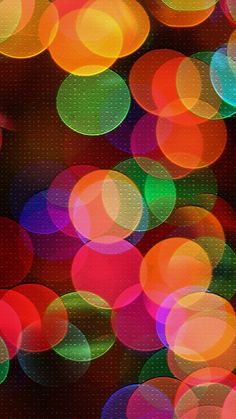 an abstract photo of colorful lights in the night sky, as well as blurry circles