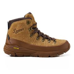 a pair of brown hiking boots with the word,'adventurer'written on it