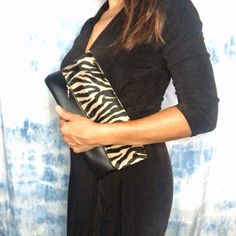 Handmade from a beautiful Zebra prints fabric and black leather. It is a roomy folded Clutch to wear on any occasion. The color may look a Litlle different from the photos, prints really are black and dark beige color  Measures: W 11 x H 9" Dark Beige Color, Prints Fabric, Large Clutch, Cute Handbags, Upcycled Denim, Dark Beige, Toiletry Storage, African Fabric, Printed Bags