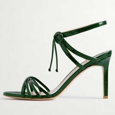 Elevate your style with these chic green crocodile embossed lace-up sandals. Featuring a strappy design and stiletto heel, these sandals exude sophistication and bold fashion-forward allure. Color: Green Heel Type: Stiletto heel Heel Height: 4.13'' / 105 mm approx Product measurements were taken using size 8. Please note that measurements may vary by size. Toe: Open toe Crocodile embossed design Strappy design Lace-up design Handcrafted US sizing. Fits true to size. Green Lace-up Sandals With Wrapped Heel, Green Strappy Leather Heels, Green Leather Strappy Heels, Luxury Lace-up Sandals For Spring, Chic Green High Heel Lace-up Sandals, Elegant Green Strappy Heels, Green Strappy Formal Sandals, Elegant Green Strappy Sandals, Luxury Lace-up Summer Sandals