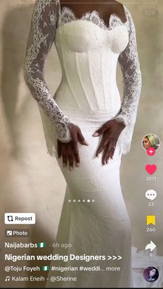 a woman in a white wedding dress with long sleeves and lace on her arms, posing for the camera