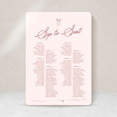 a pink wedding seating card with the words,'stop to seat'on it