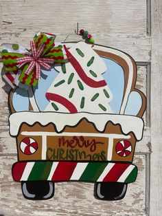 a wooden sign that says merry christmas with an ice cream truck