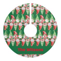 a green and red christmas tree skirt with the words, the wilsons on it