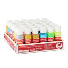 a display case filled with lots of different colors of paint on white background for sale